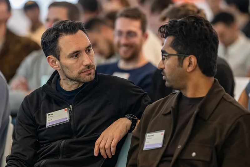Govind Kavaturi and Mike Molinet, Dock co-founders, seated among attendees at the Y Combinator (YC) kickoff.