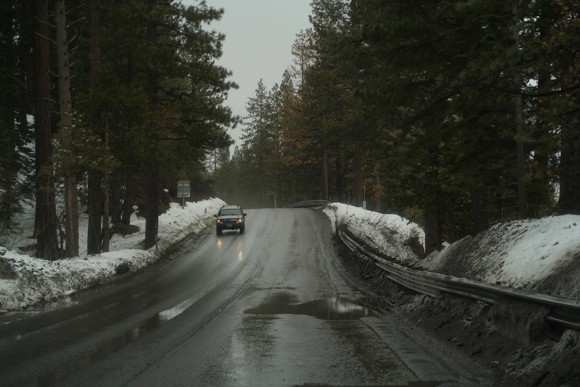 Govind Kavaturi photography - Lake Tahoe snowy mountain road through pine forest